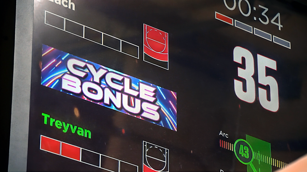 A digital scoreboard displays CYCLE BONUS, a score of 35, the name Treyvan, and other game graphics with red and green bars and timers.